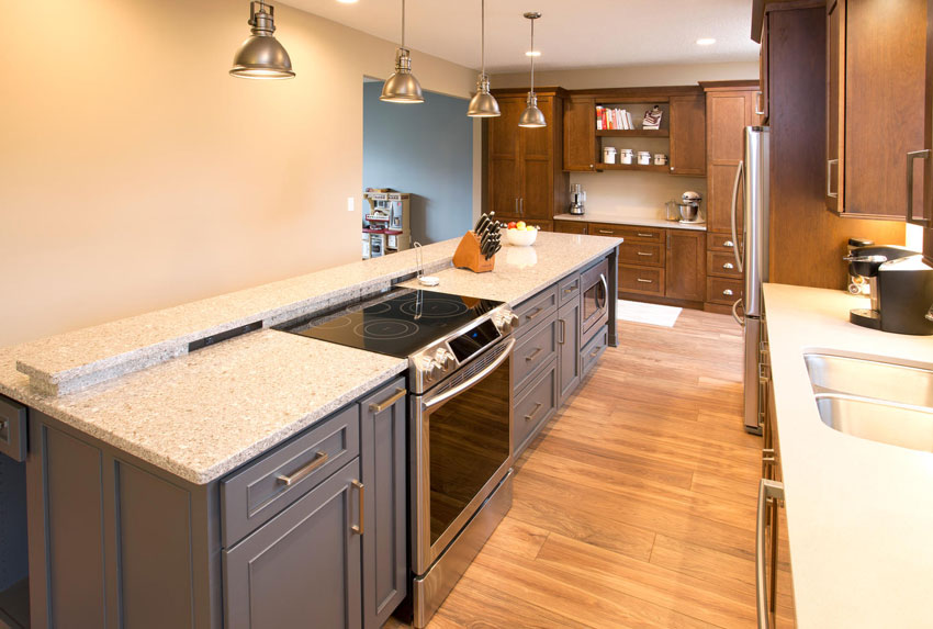 Full kitchen with stove and island counter