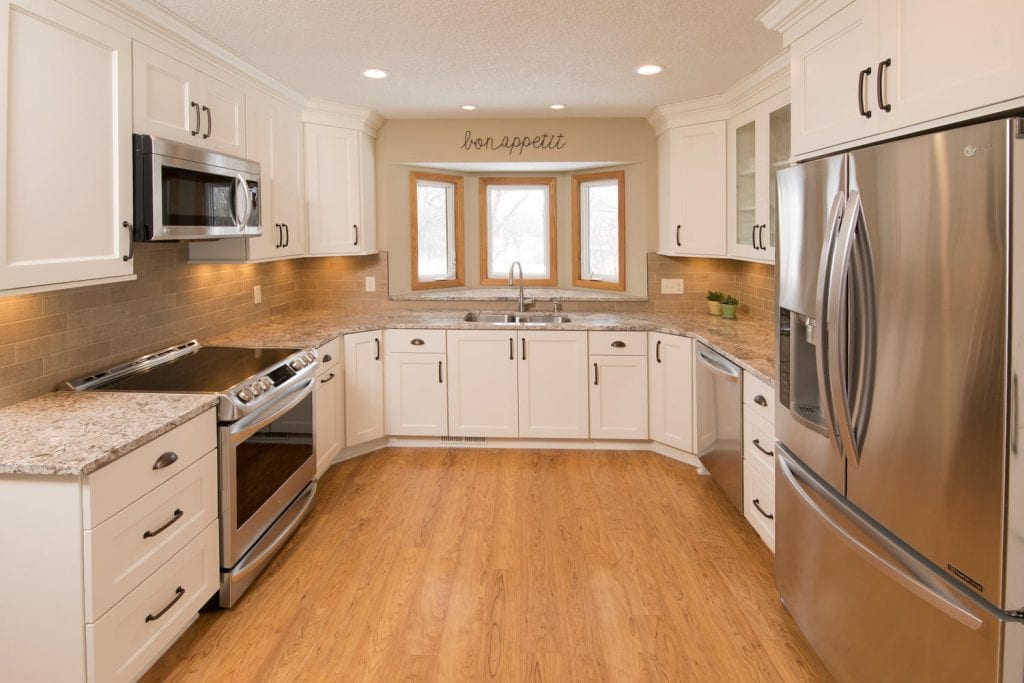 After kitchen remodel with white cabinets 