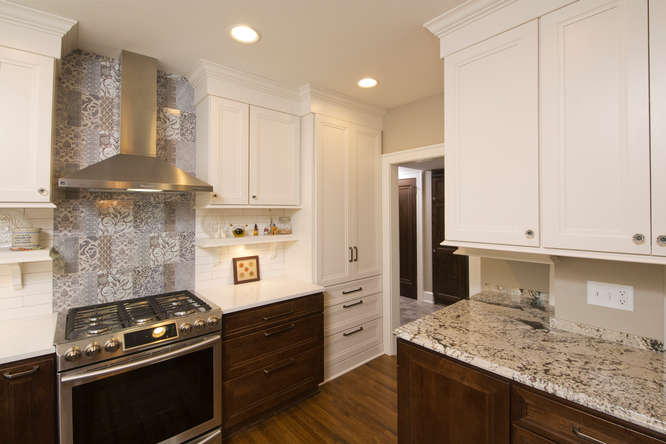 Kitchen with white cabinets and stove